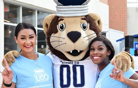 Two students with Big Blue ODU mascot